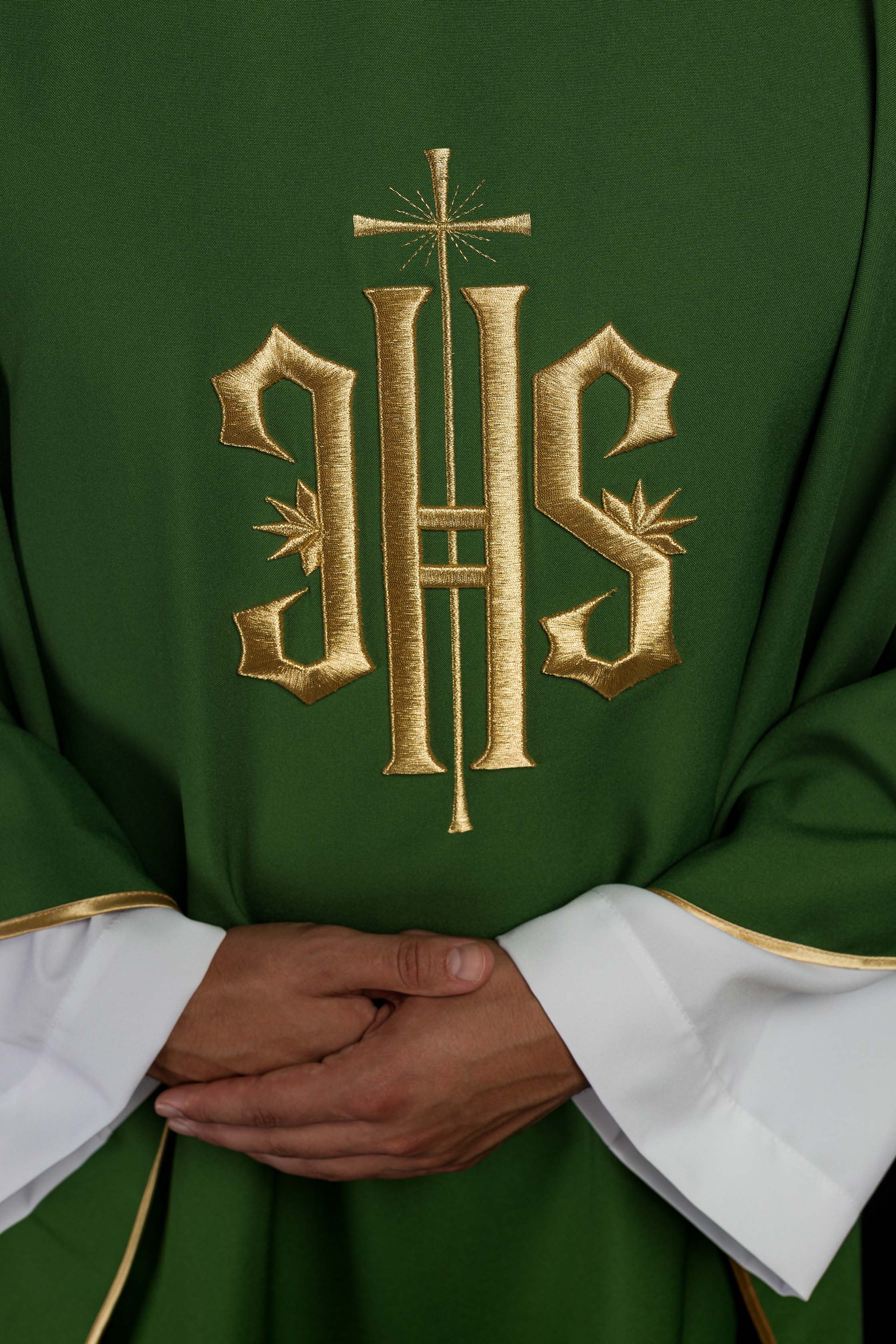 Green chasuble embroidered with IHS motif