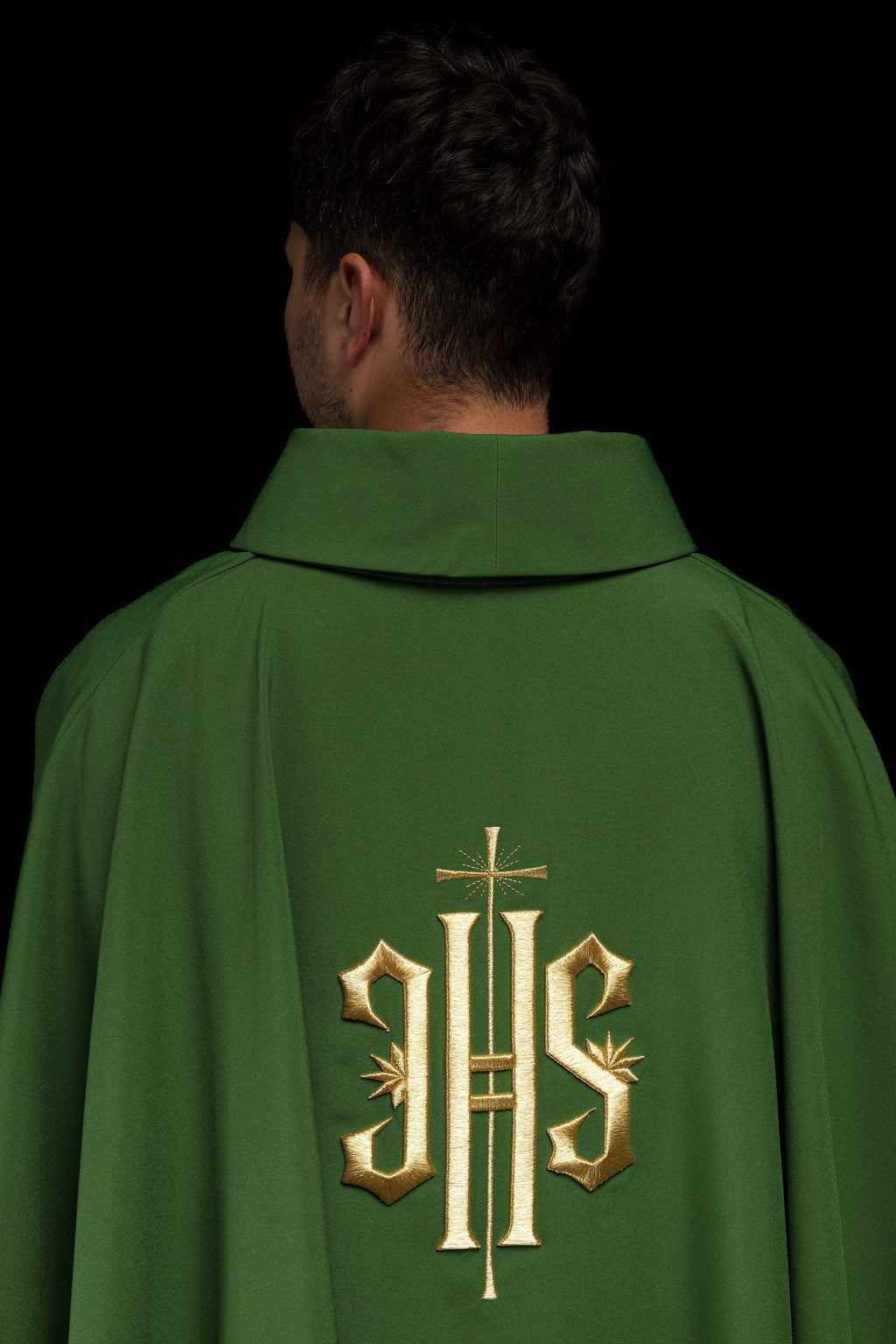 Green chasuble embroidered with IHS motif