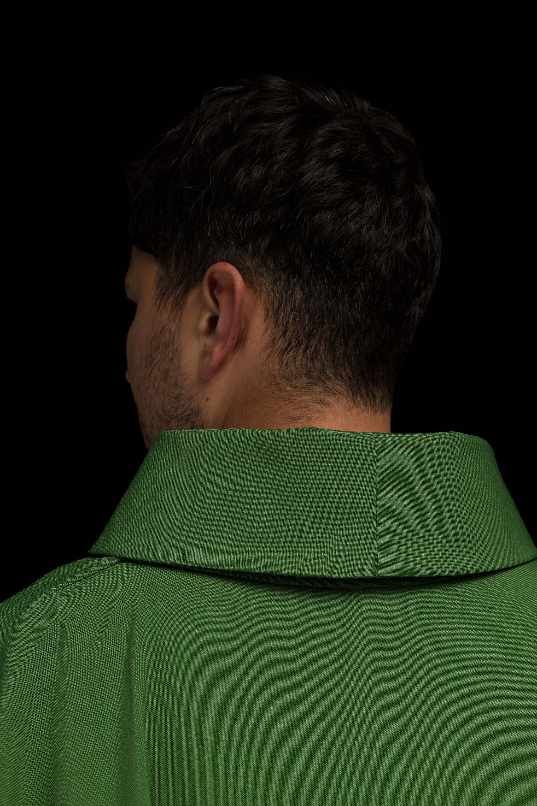 Green chasuble embroidered with IHS motif