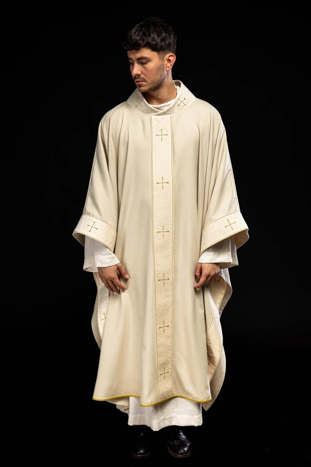 Chasuble in ecru color with an embroidered band and collar decorated with crosses